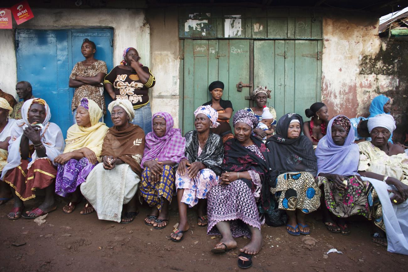 Women wait to vote during presidential elections in Freetown.