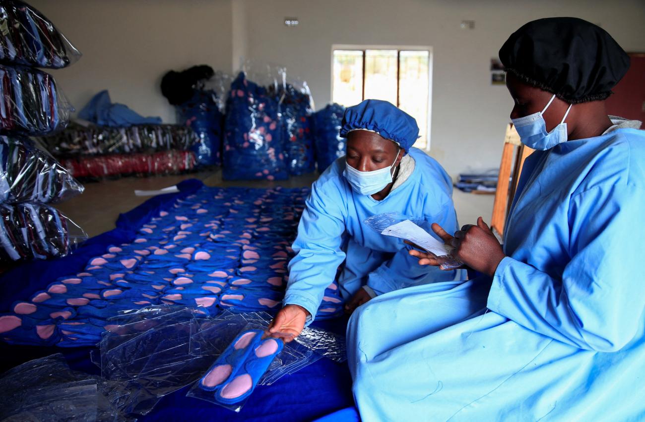 Women work inside a factory at Bonda Women Craft Centre, a reusable sanitary pads manufacturing company in Mutasa district.