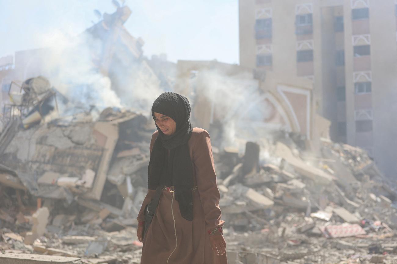 A Palestinian woman reacts after her apartment was destroyed in an Israeli raid.