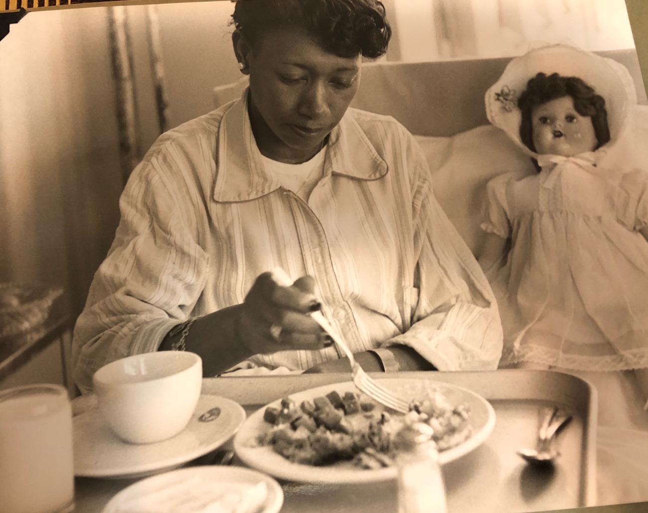 A patient eats a meal at Sea View's women's pavilion in the early 1950s.