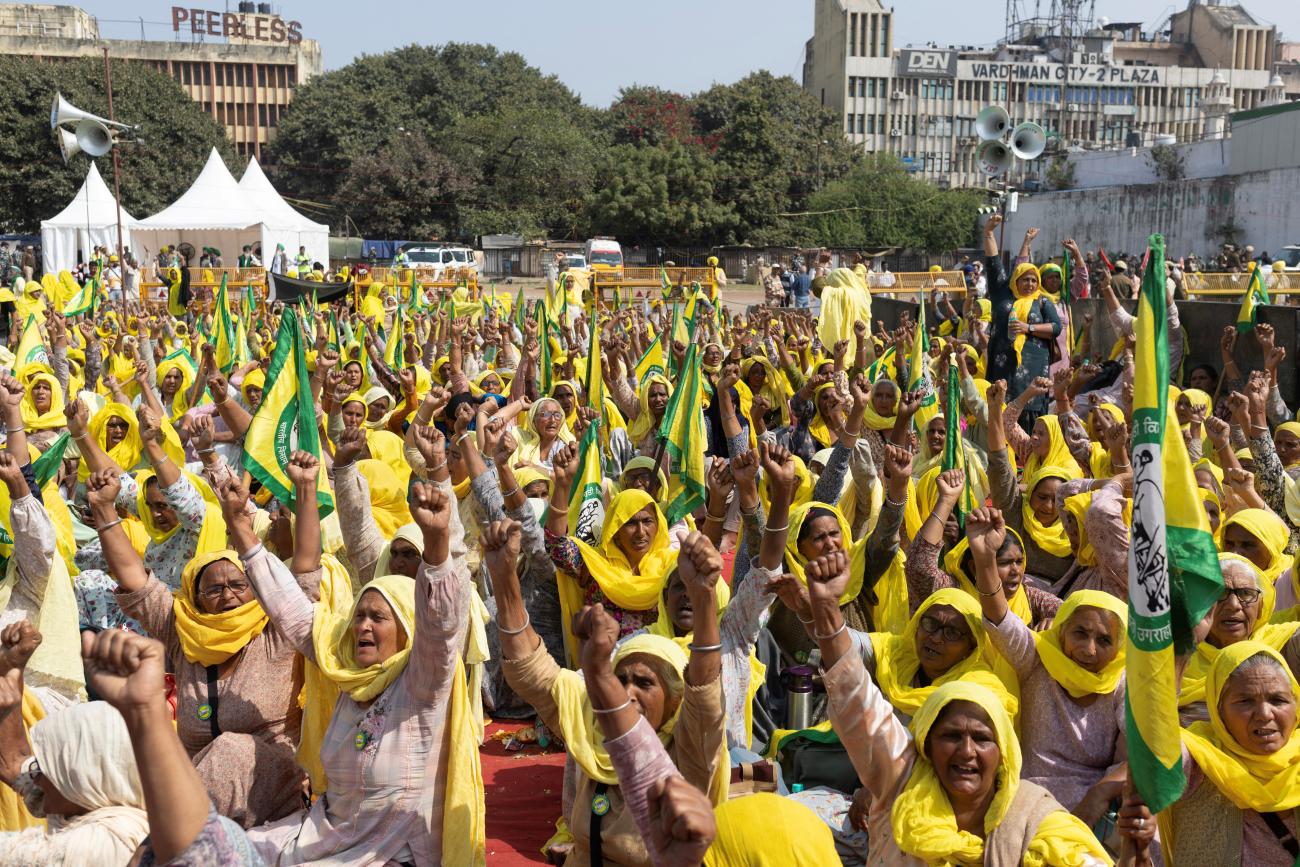 Farmers raise slogans during a Maha Panchayat or grand village council meeting.