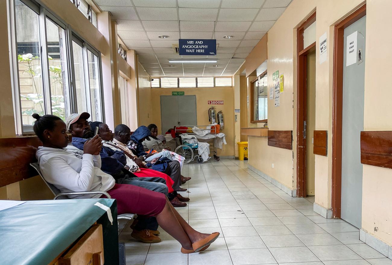 Patients and relatives wait inside the Kenyatta National Hospital.