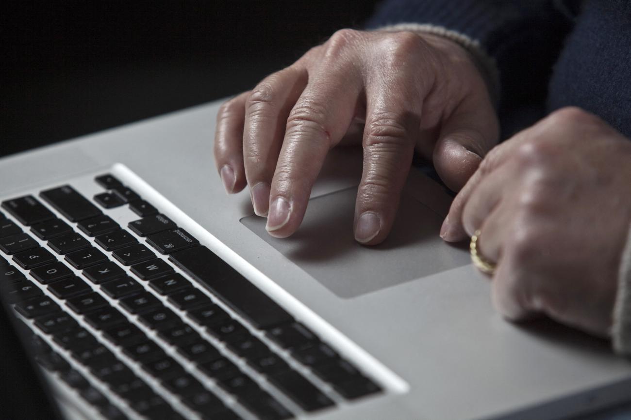John Bumgarner, a cyber warfare expert who is chief technology officer of the U.S. Cyber Consequences Unit, works on his laptop computer.