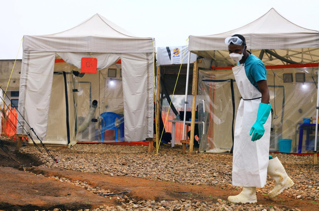 A health worker is seen preparing a facility for Ebola patients at the Ebola Treatment Center.