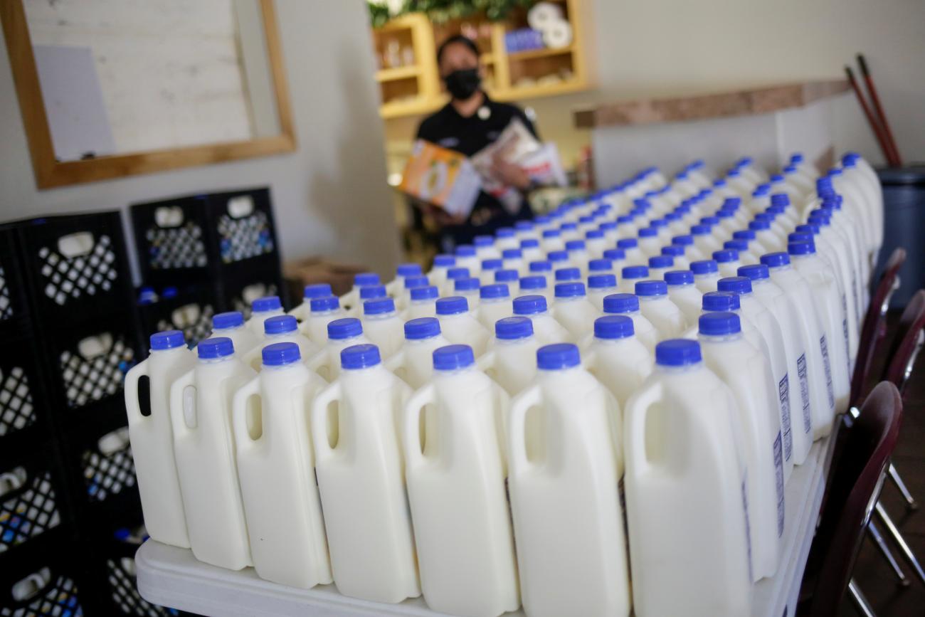 Plastic containers with milk are seen inside the El Elyon church.