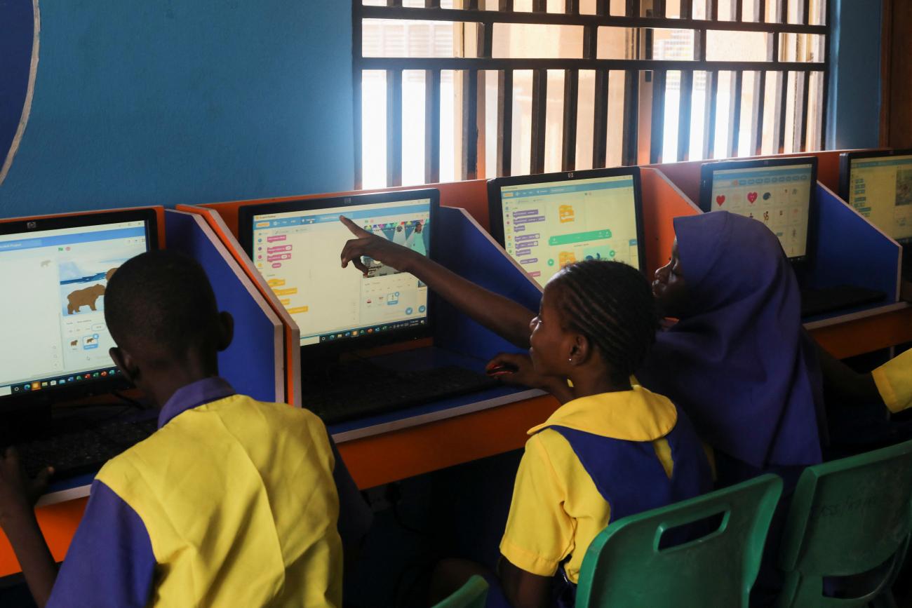 Students enrolled in a special STEM program for children at the Knosk Secondary School attend a computer class.