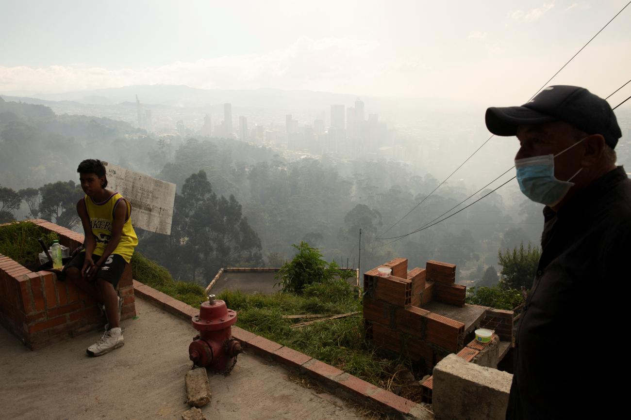 A man wears a face mask after the district government declared an air quality emergency due to forest fires.