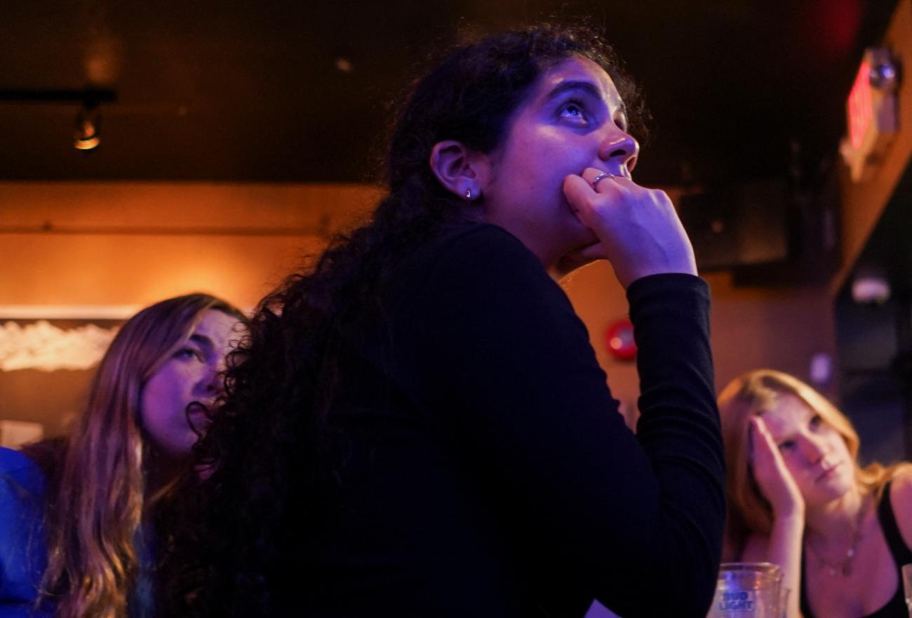 People attend a watch party for the first U.S. presidential debate hosted by CNN in Atlanta, at Union Pub on Capitol Hill in Washington, DC, June 27, 2024.