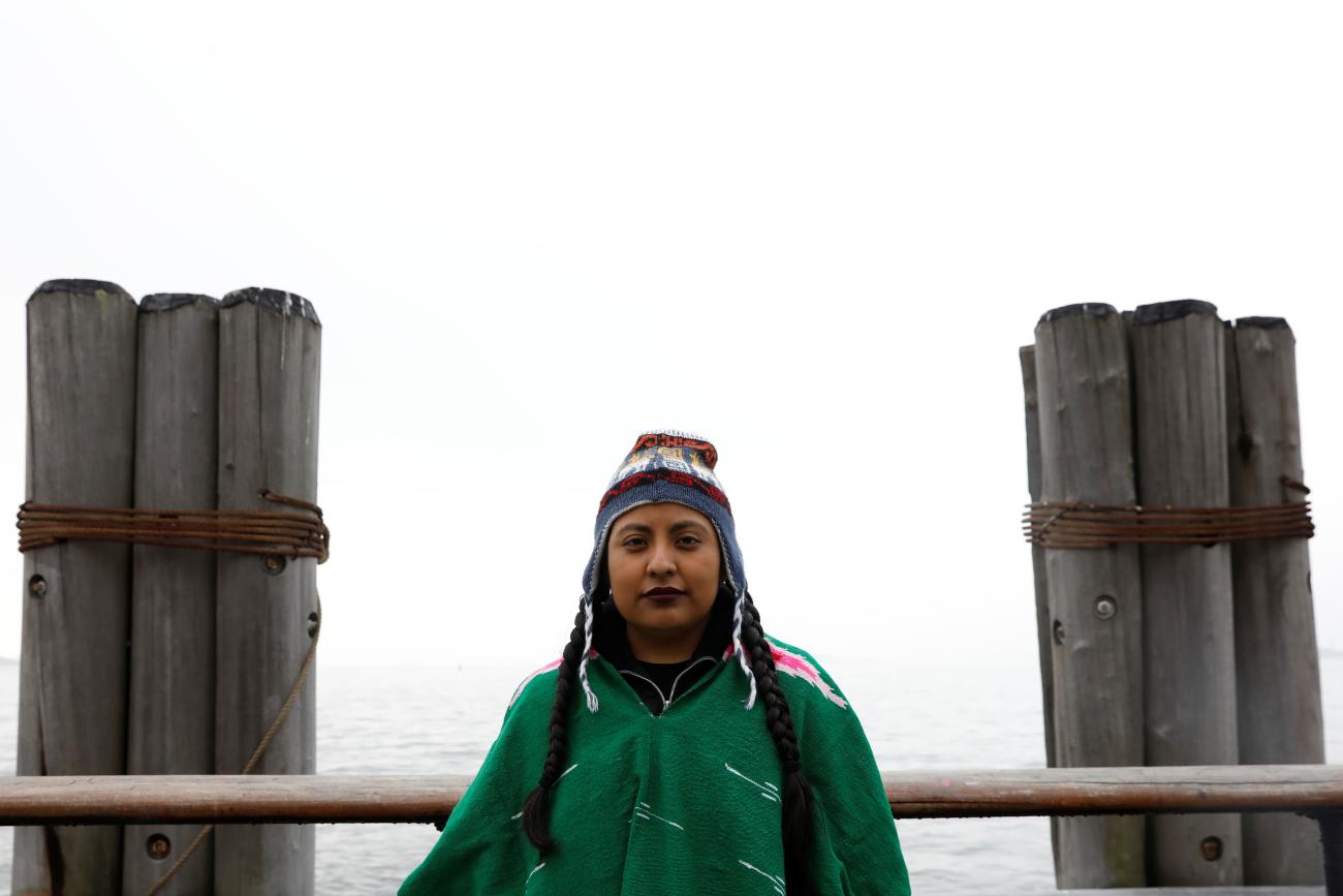 Cata Santiago, a DACA recipient who migrated with her parents from Mexico, poses for a photo in Battery Park before starting the 'Walk to Stay Home.’ 