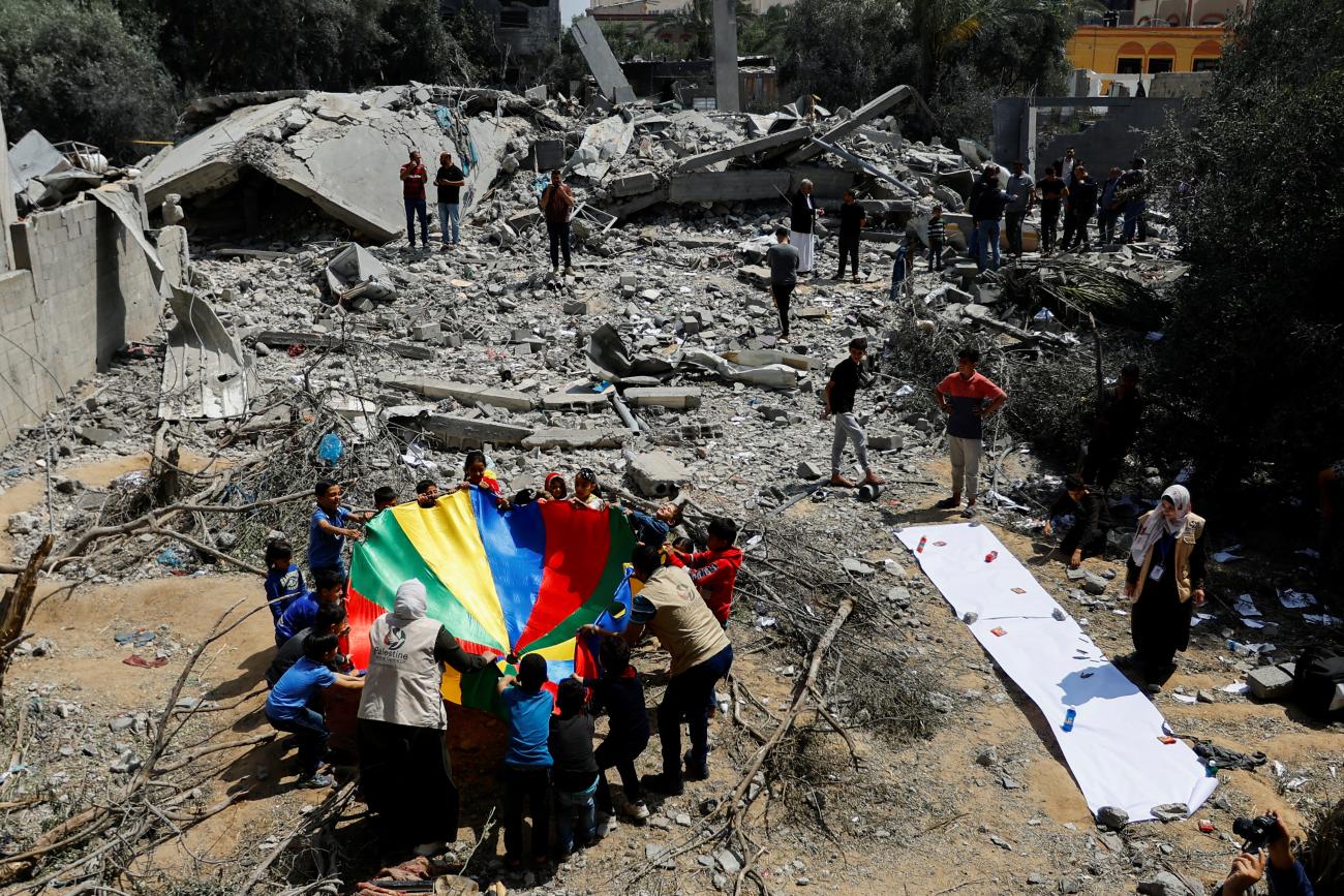 Palestinian children participate in an activity aimed to support the mental health of children affected by the conflict between Israel and Hamas.