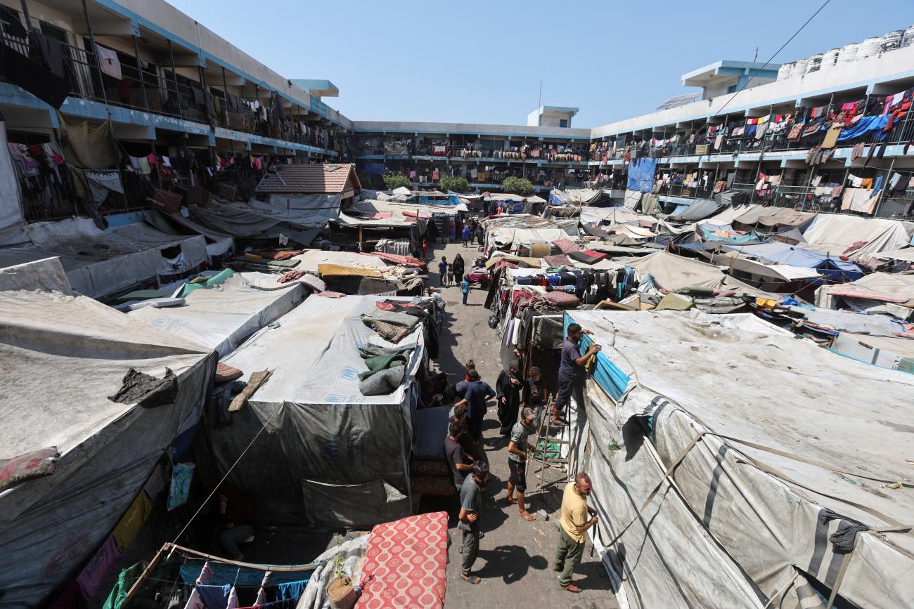 Displaced Palestinians shelter in a United Nations-run school, amid Israel-Hamas conflict.
