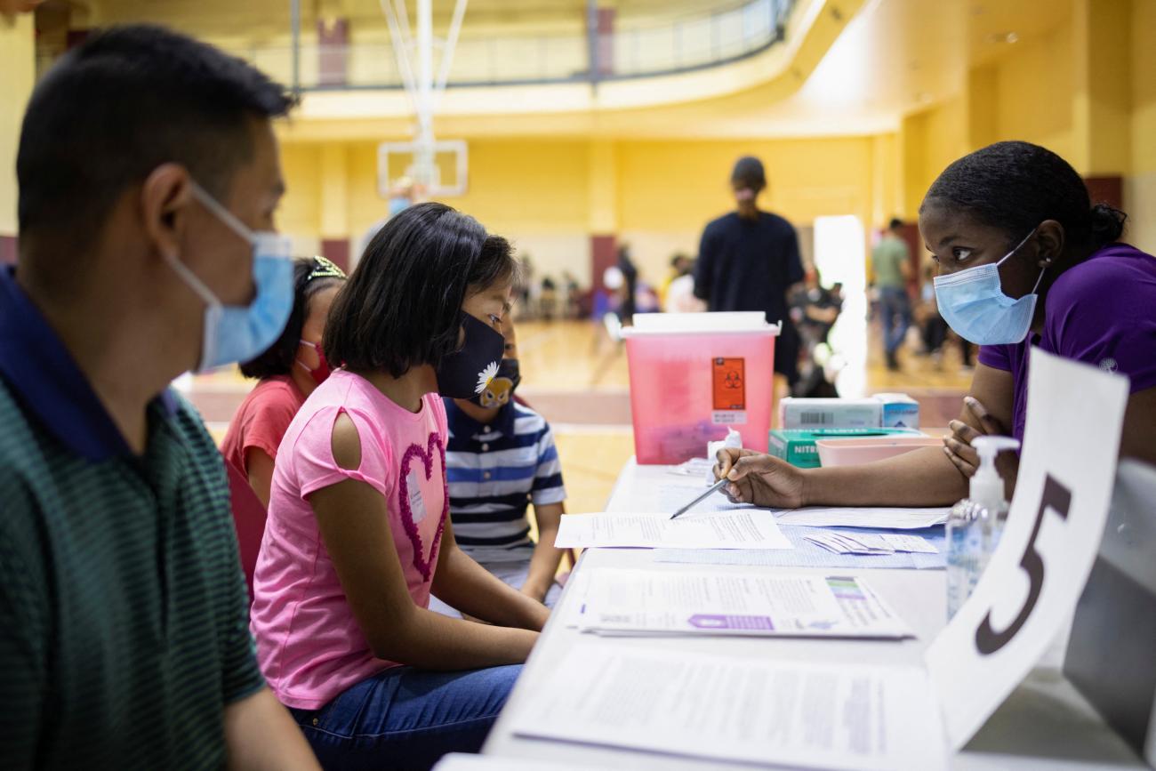 Victoria Zaca, 12, is prepared to receive a coronavirus disease (COVID-19) vaccine at a clinic run by the Philadelphia Department of Public Health in partnership with the Black Doctors COVID-19 Consortium to encourage all eligible teenagers to get vaccinated in Philadelphia, Pennsylvania, May 18, 2021.
