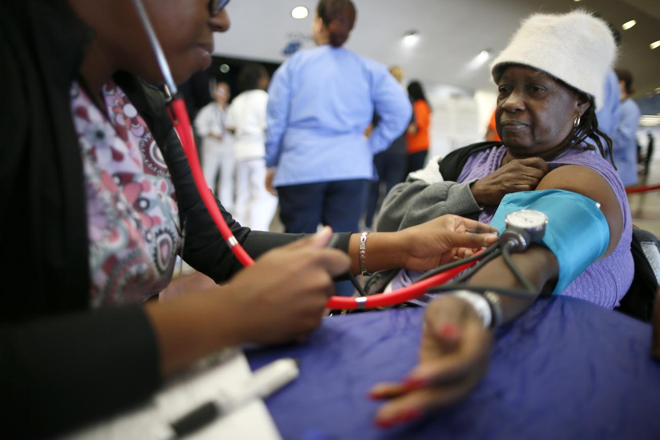 Carolyn Jackson has her blood pressure measured at Care Harbor LA free medical clinic.