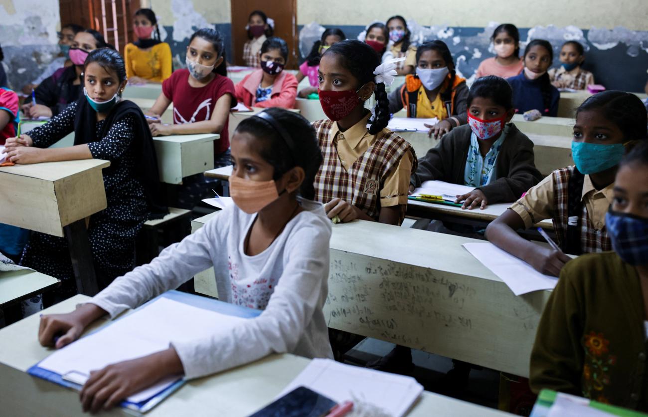 Students attend class in a school after they reopened amidst the spread of COVID-19.
