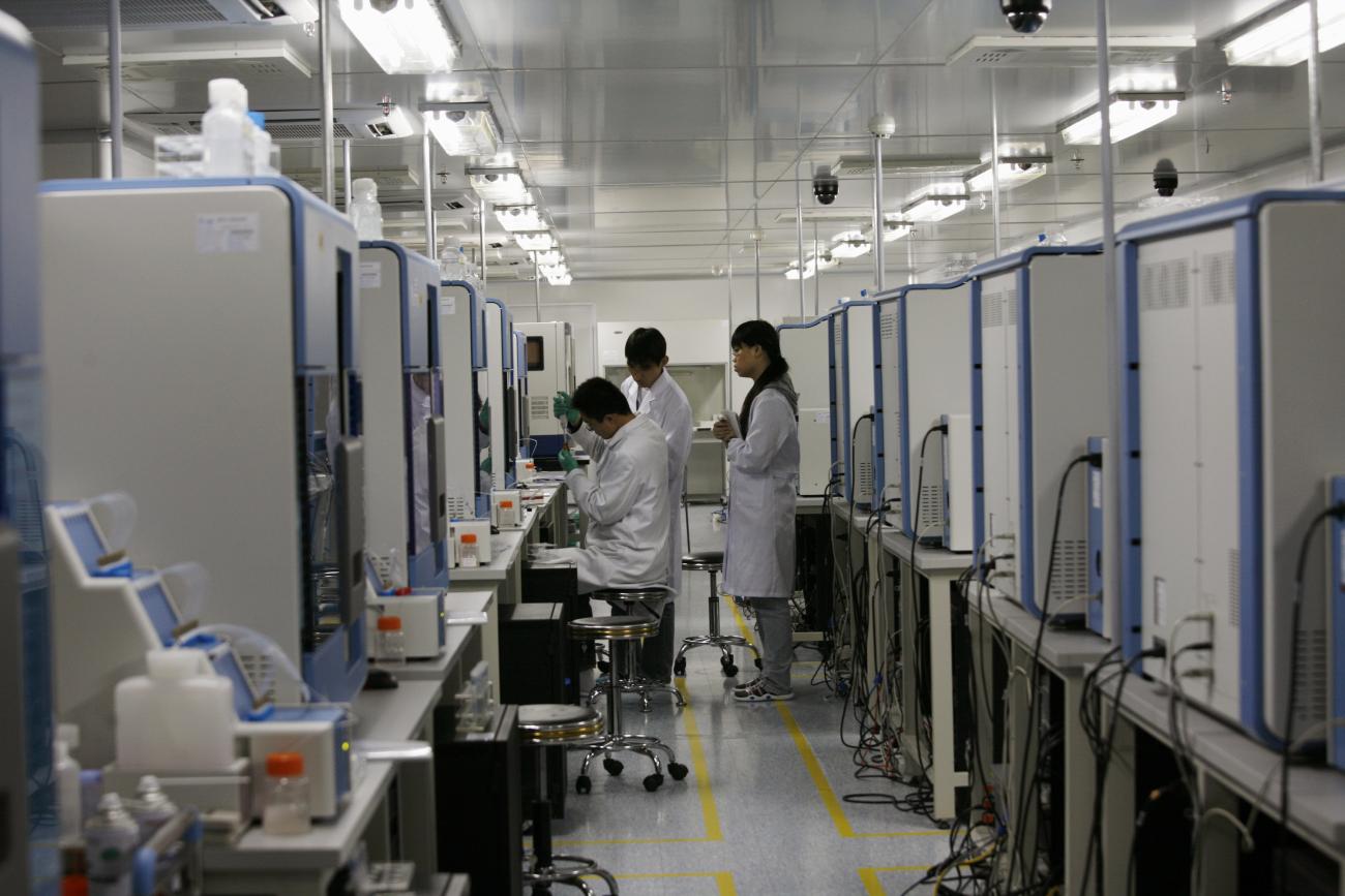 Researchers work with gene sequencers at the Beijing Genomics Institute, in Shenzhen, China, on March 3, 2010.
