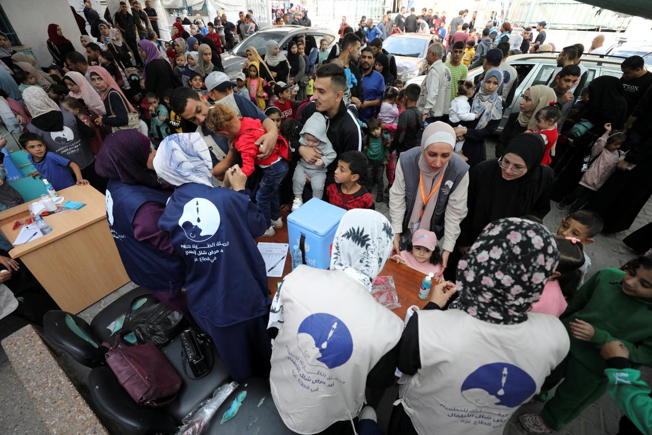 Palestinian children are vaccinated against polio during the second round of a vaccination campaign, in Gaza City, on November 2, 2024. 