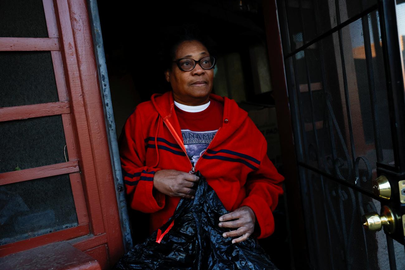 Lorraine Bryan, 63, who lost her home in Altadena during the Eaton Fire and was struggling to get insulin she needs, stands in her doorway, in Altadena, California, on January 13, 2025.