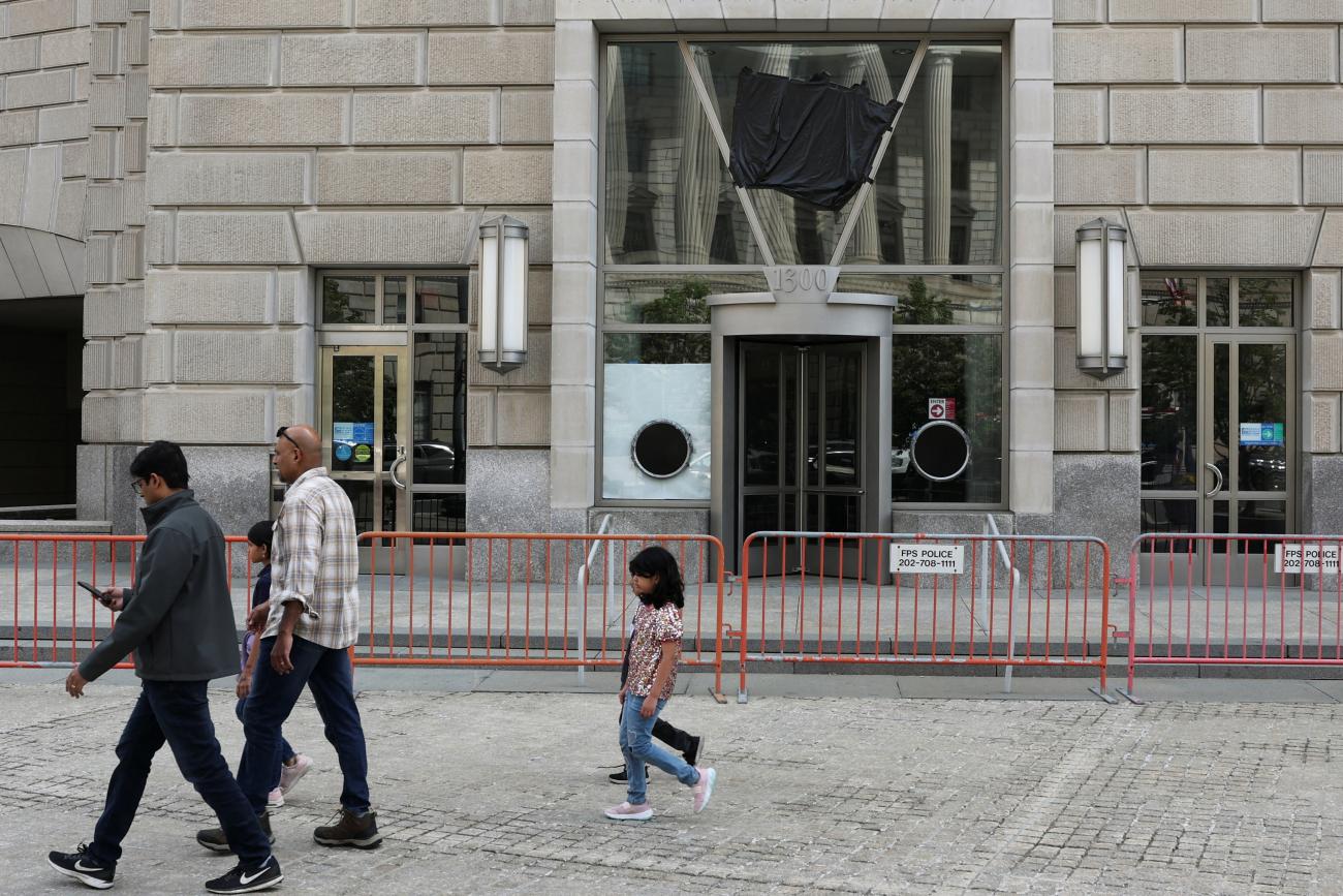 A black plastic shroud covers the signage on the windows of the former offices of the U.S. Agency for International Development, in Washington, DC, on April 24, 2025.