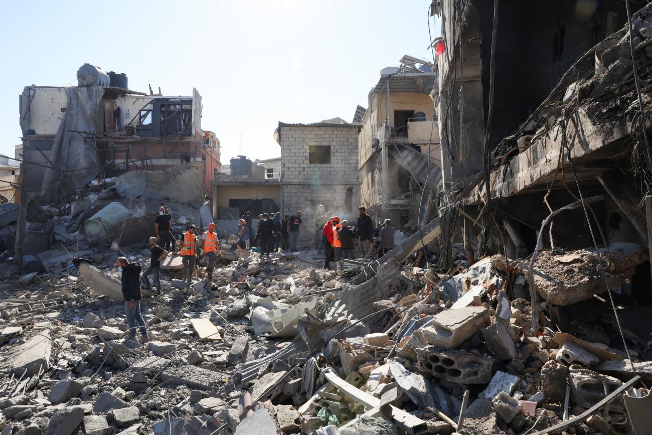 Rescuers search for survivors at the site of an Israeli strike near Rafik Hariri University Hospital, in Beirut, Lebanon, on October 22, 2024. 