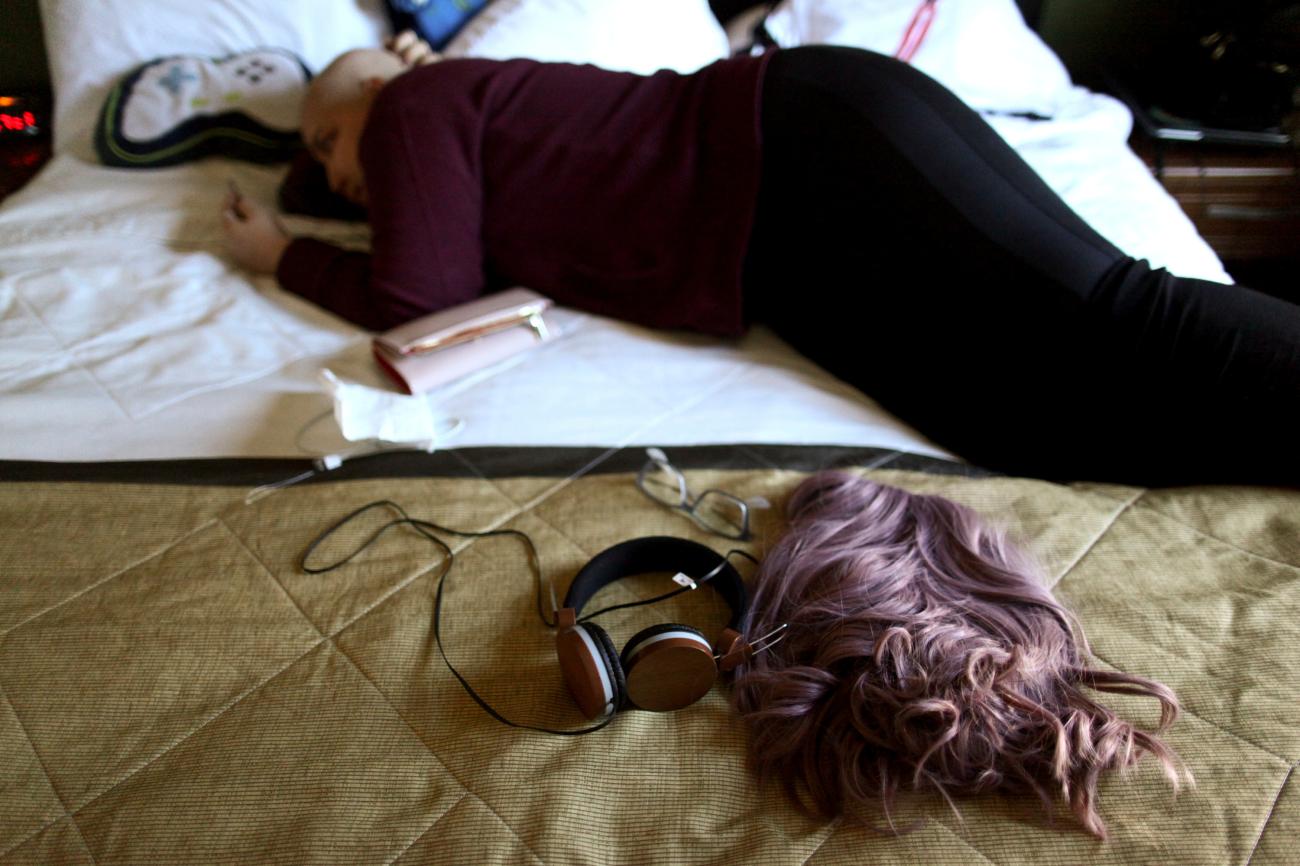 Keyshla Betancourt, 22, lies on a bed after a radiotherapy treatment at a hotel where she lived in Orlando, Florida after fleeing the Hurricane Maria's devastation of Puerto Rico, December 11, 2017. She acquired Florida's Medicaid plan, which paid for her daily treatments.
