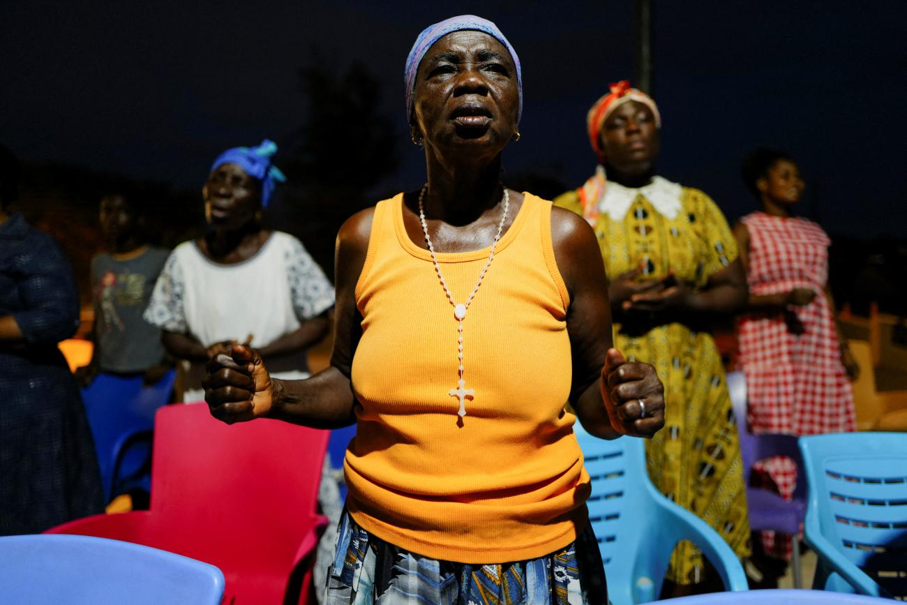 Catholics pray after the announcement of Leo XIV as the new Pope at the St. John The Baptist Church, in Cape Coast, Ghana, on May 8, 2025. 