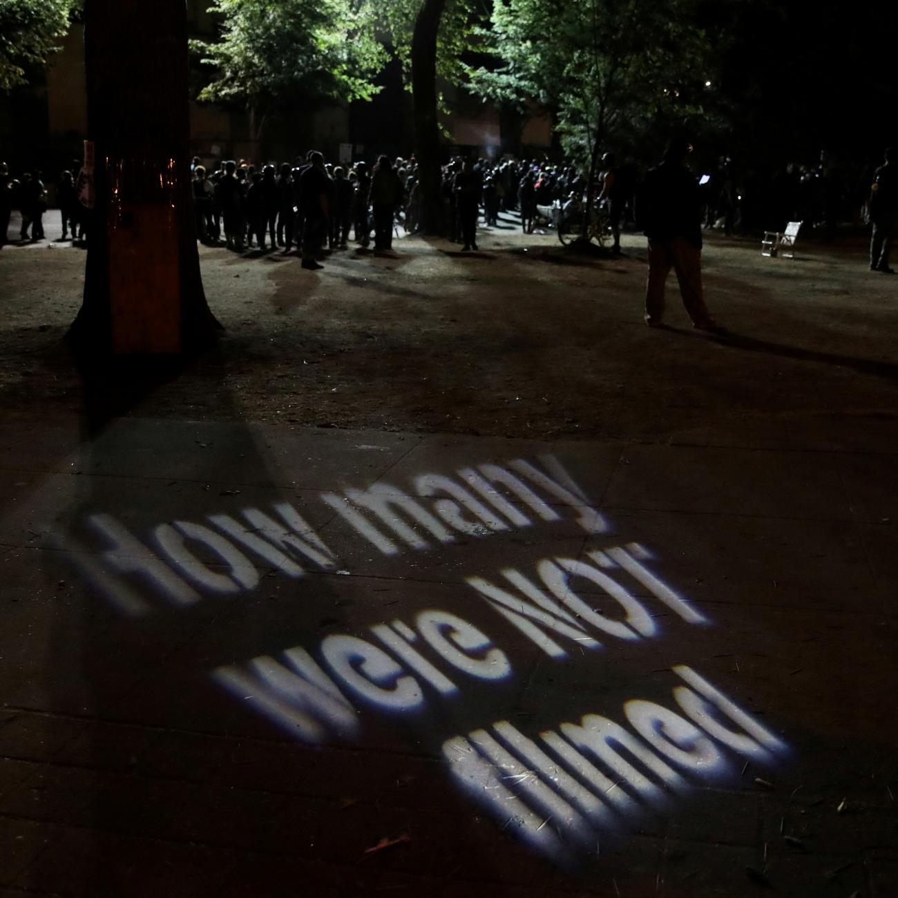 A protester casts a projection during a demonstration against police violence and racial inequality in Portland, Oregon, U.S., August 1, 2020. 