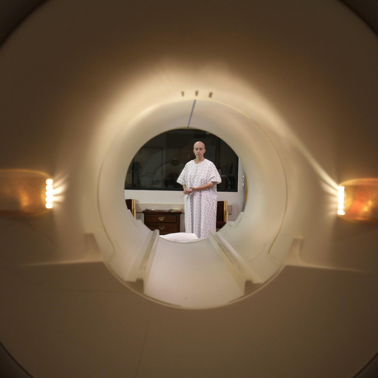 Cancer patient Deborah Charles is seen through the tube of a magnetic resonance imaging scanner as she prepares to enter the MRI machine for an examination at Georgetown University Hospital in Washington May 23, 2007. 