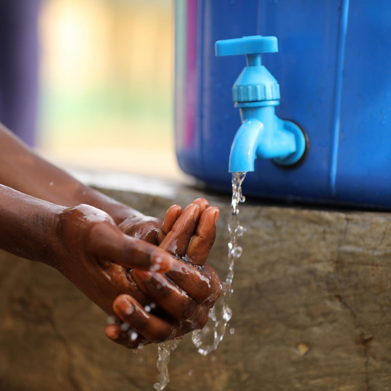 A student washes her hands at a school in Abuja, Nigeria, on March 20, 2020.