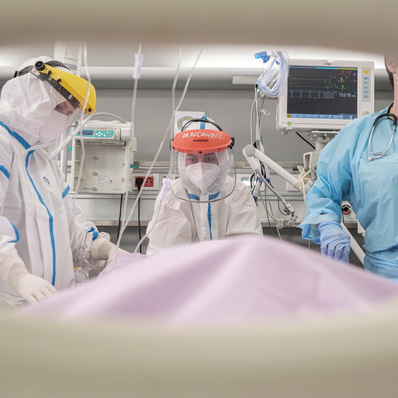 Doctor Tatjana Peric treats a patient suffering from COVID-19 on International Women's Day at the intensive care unit of the Clinical Center of Vojvodina, in Novi Sad, Serbia, March 8, 2021.