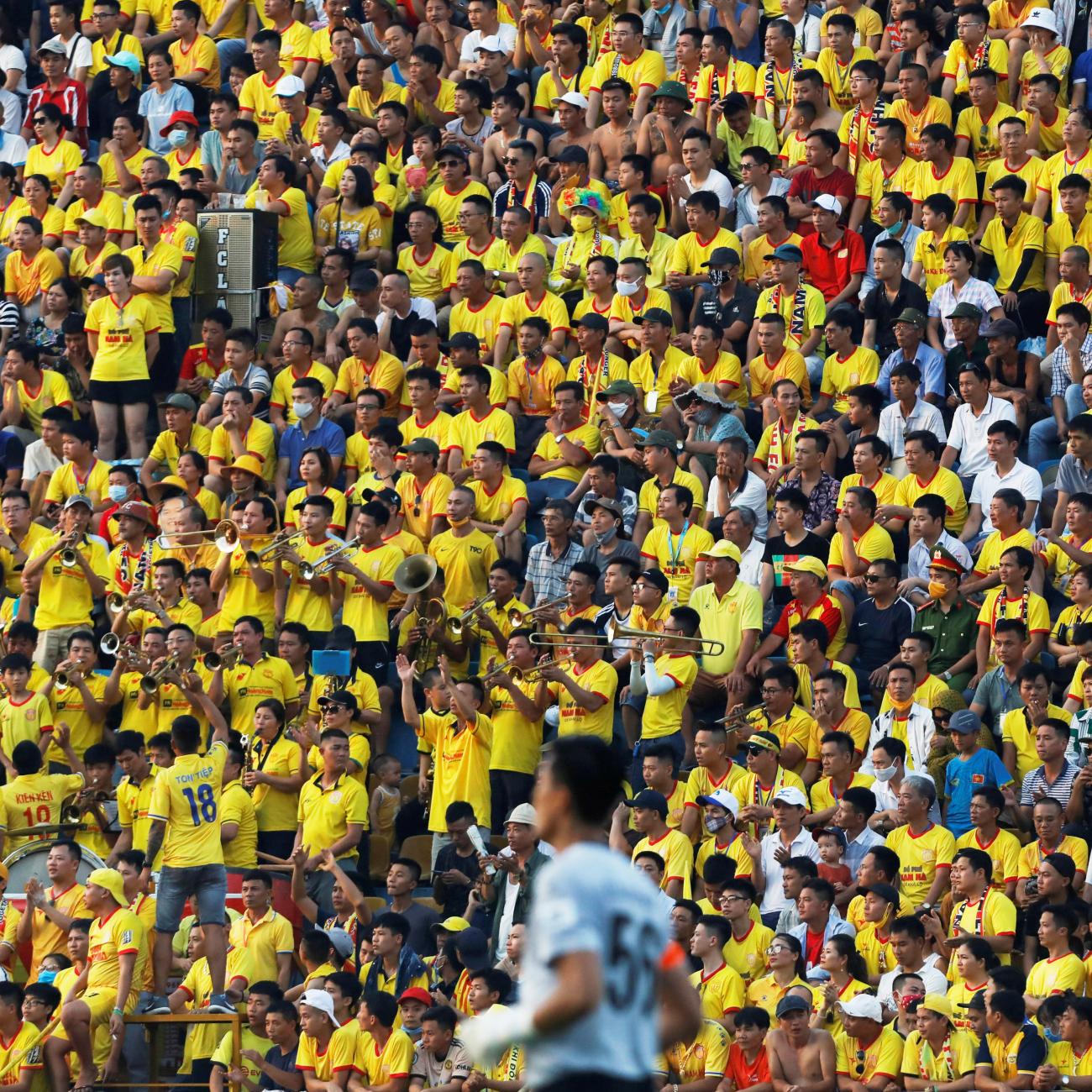 Soccer fans attend a match between Viettel and Duoc Nam Ha Nam Dinh of Vietnam's national soccer league after an outbreak and nationwide COVID-19 lockdown, in Nam Dinh province, Vietnam, on June 5, 2020.