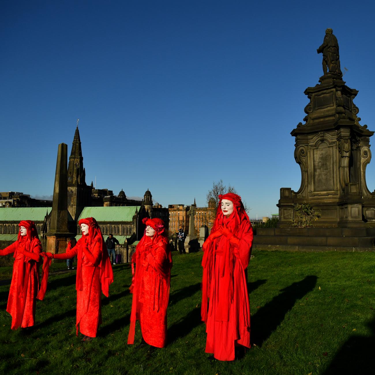 Activists take part in a mock funeral at Glasgow Necropolis during the UN Climate Change Conference (COP26) in Glasgow, Scotland, Britain November 13, 2021.