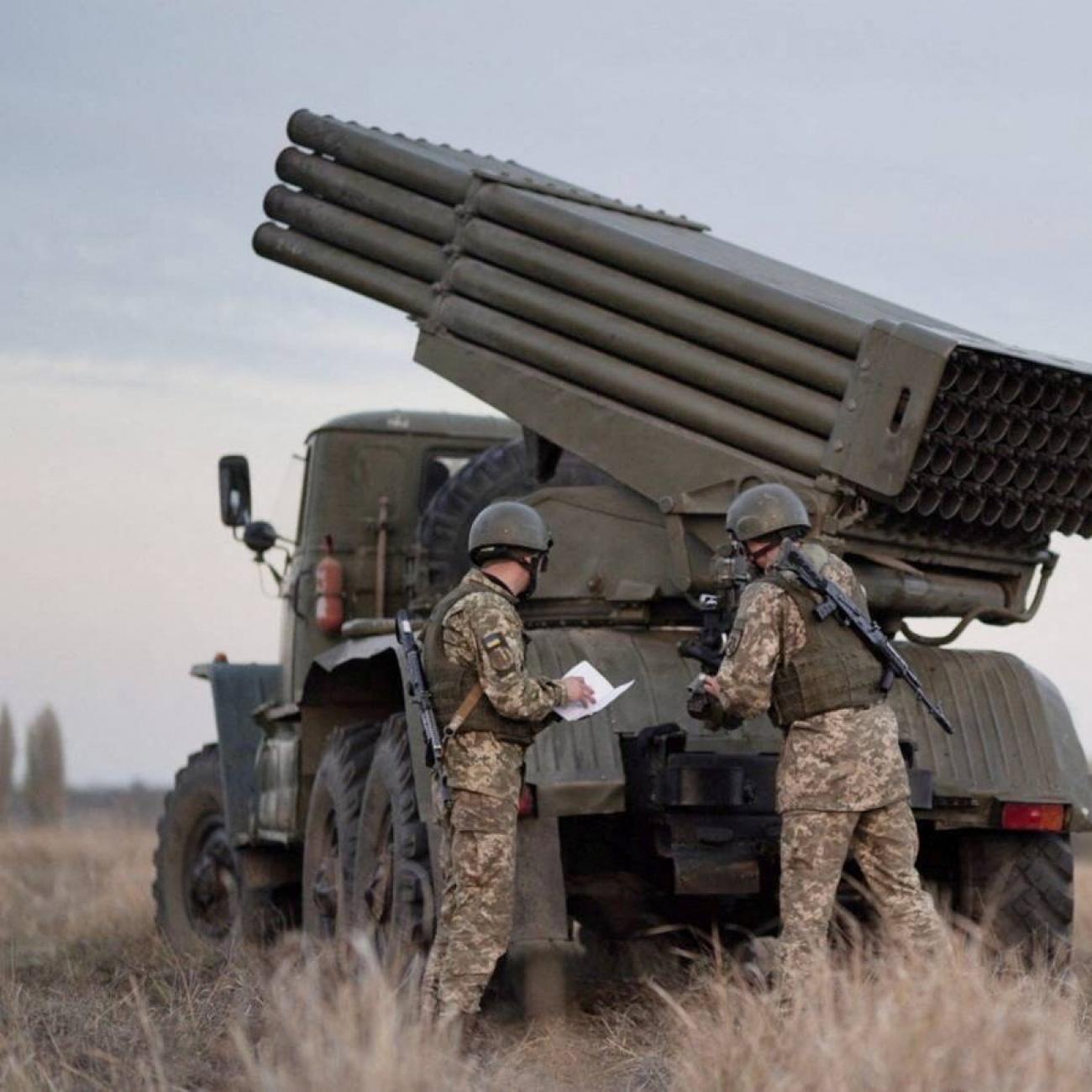 Service members of the Ukrainian Armed Forces gather near BM-21 "Grad" multiple rocket launchers during tactical military exercises at a shooting range in Kherson, Ukraine, on January 19, 2022