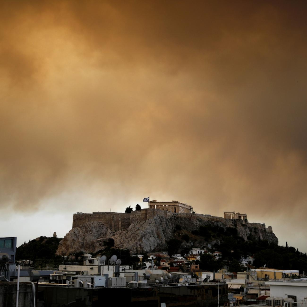 a fire is seen blazing over the parthenon in athens 