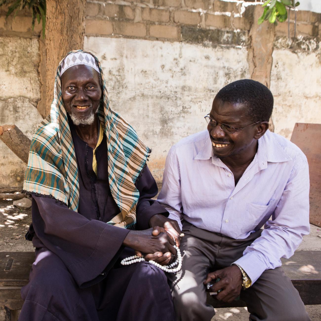 a man shakes hands with his nurse