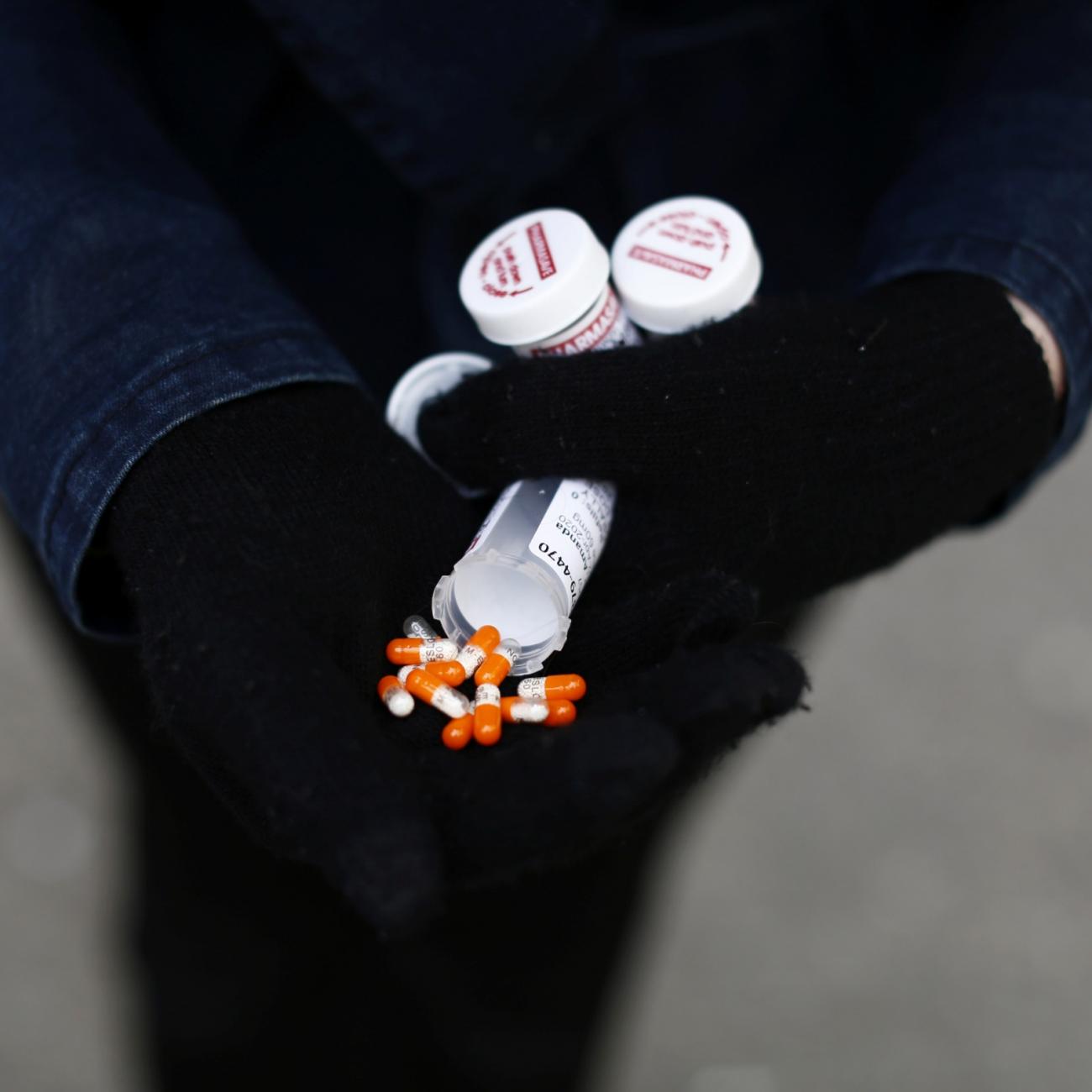 A fentanyl user displays a "safe supply" of opioid alternatives in Vancouver, Canada