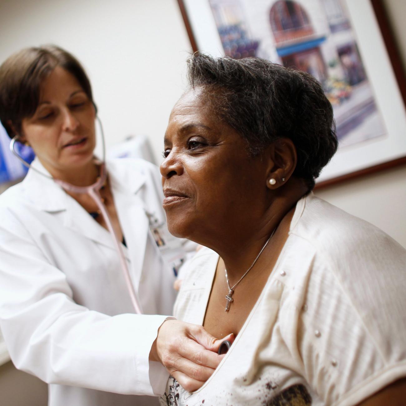 A woman receives a checkup from her primary care physician in Chicago, Illinois, June 28, 2012.