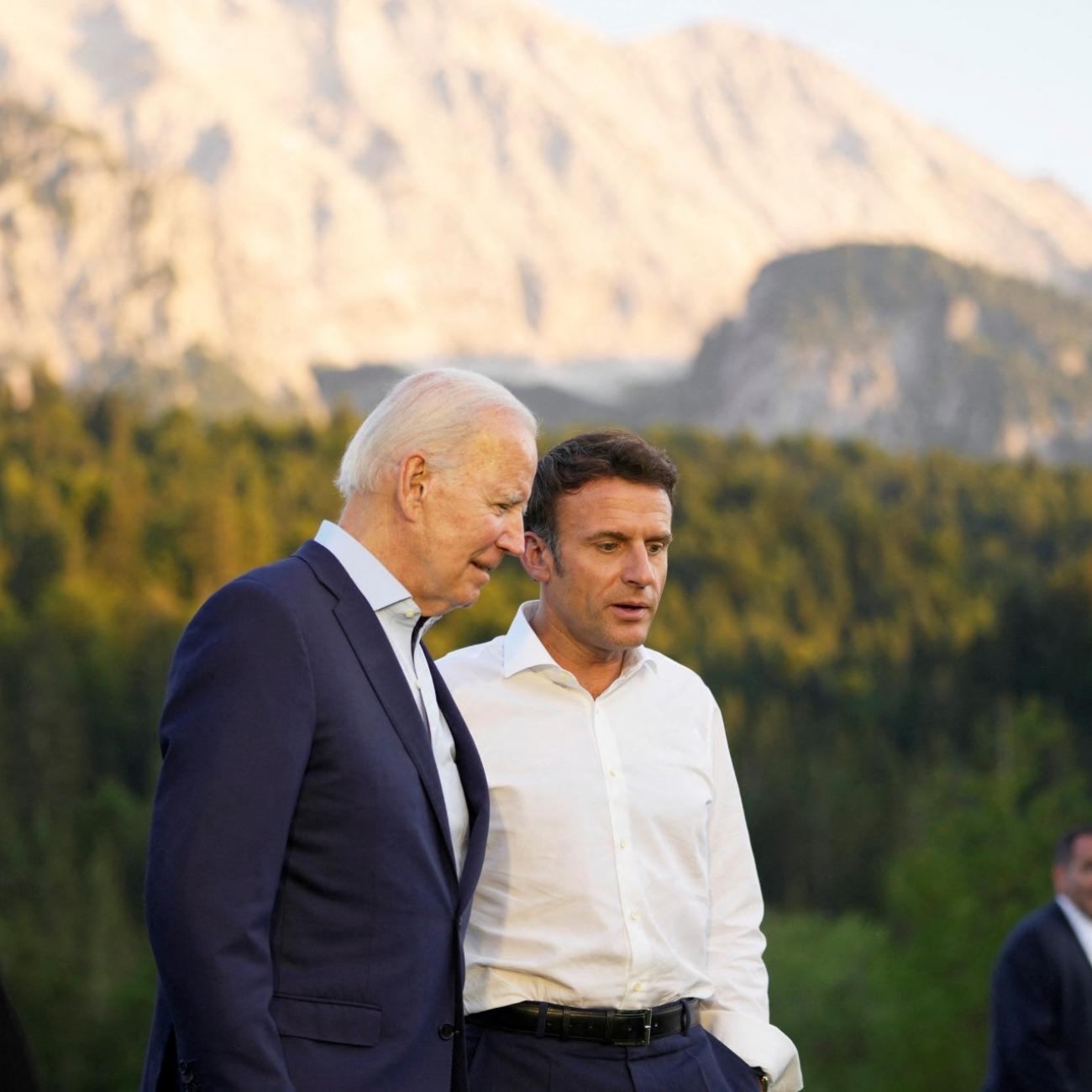 DOCUMENT DATE:  June 26, 2022  French President Emmanuel Macron, center right, speaks with U.S. President Joe Biden after a group photo at the G7 summit at Castle Elmau in Krue