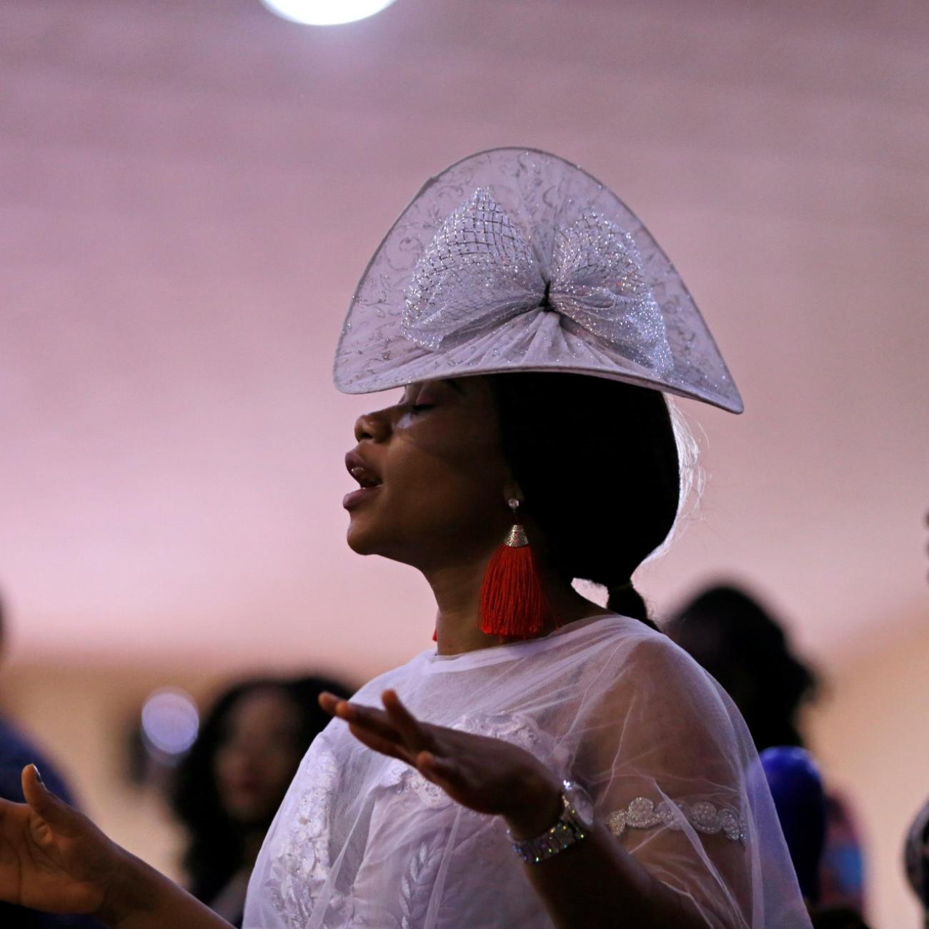 A woman attends a church service at Living Faith Church, following the outbreak of the coronavirus disease (COVID-19), in Abuja, Nigeria March 22, 2020