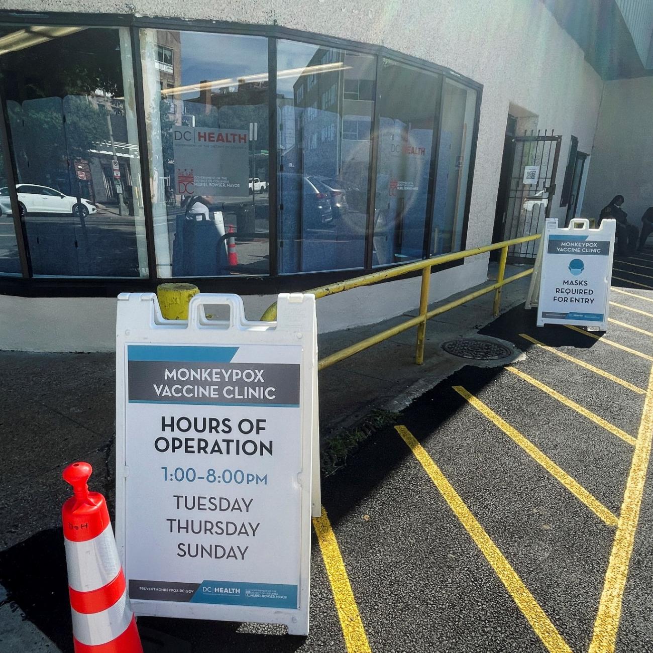 a monkeypox vaccination sign is seen in a parking lot