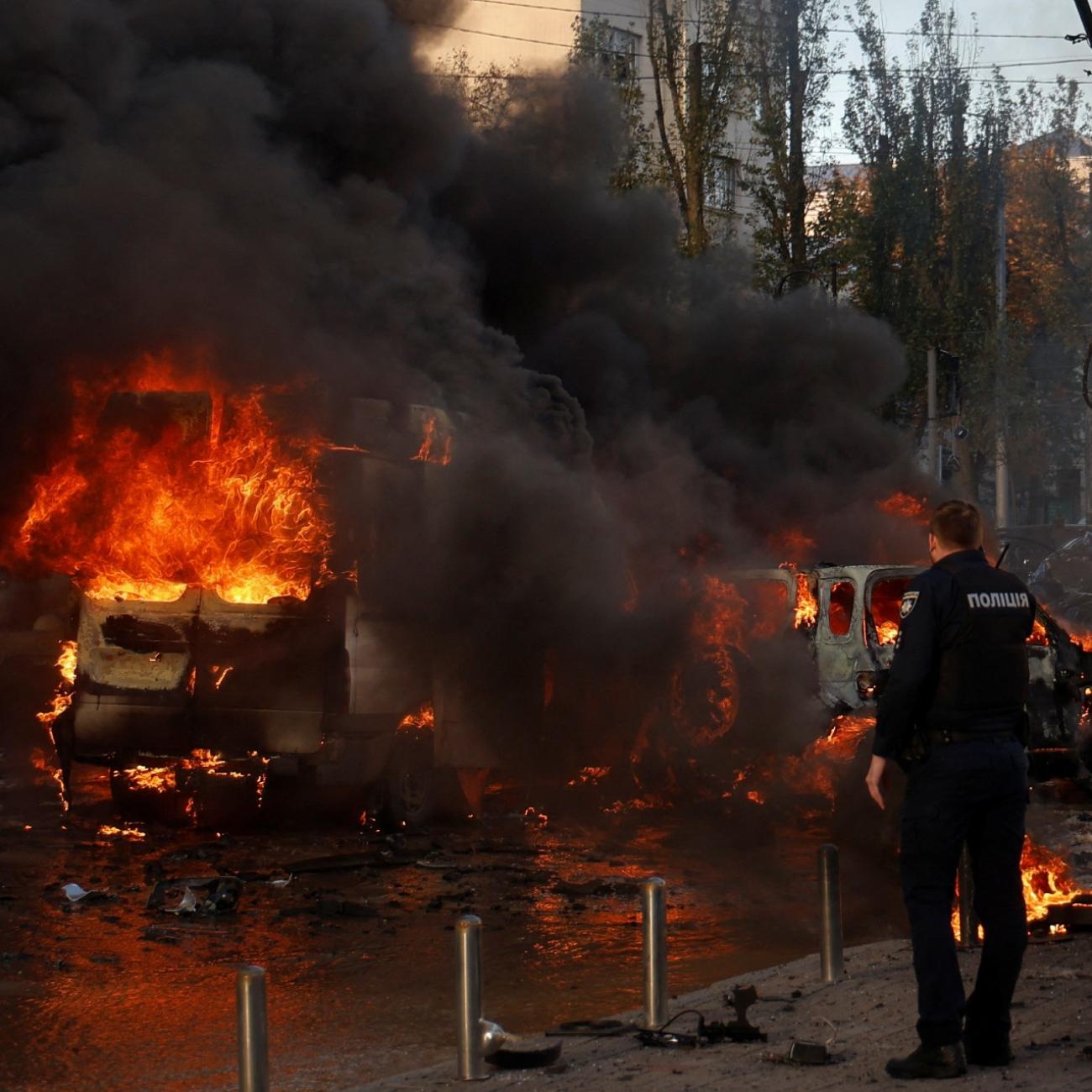 Cars are on fire after Russia's missile attack in Kyiv, Ukraine, on October 10, 2022.