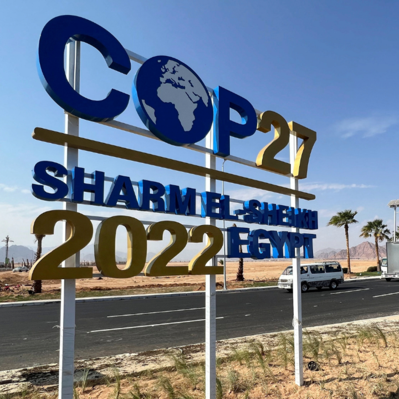 View of a COP27 sign on the road leading to the conference area in Egypt's Red Sea resort town of Sharm el-Sheikh as the city prepares to host the COP27 climate summit, in Sharm el-Sheikh, Egypt, on October 20, 2022. 