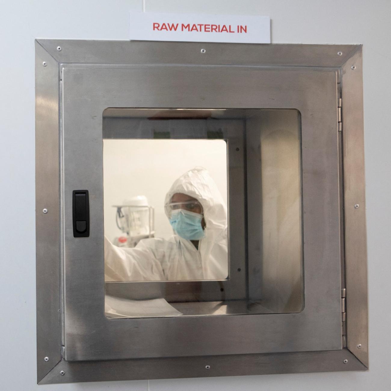 A production scientist works with samples during a visit by representatives of the Medicines Patent Pool, France and other European Union member states, at the Afrigen Biologics' site in Cape Town, South Africa, February 3, 2022.