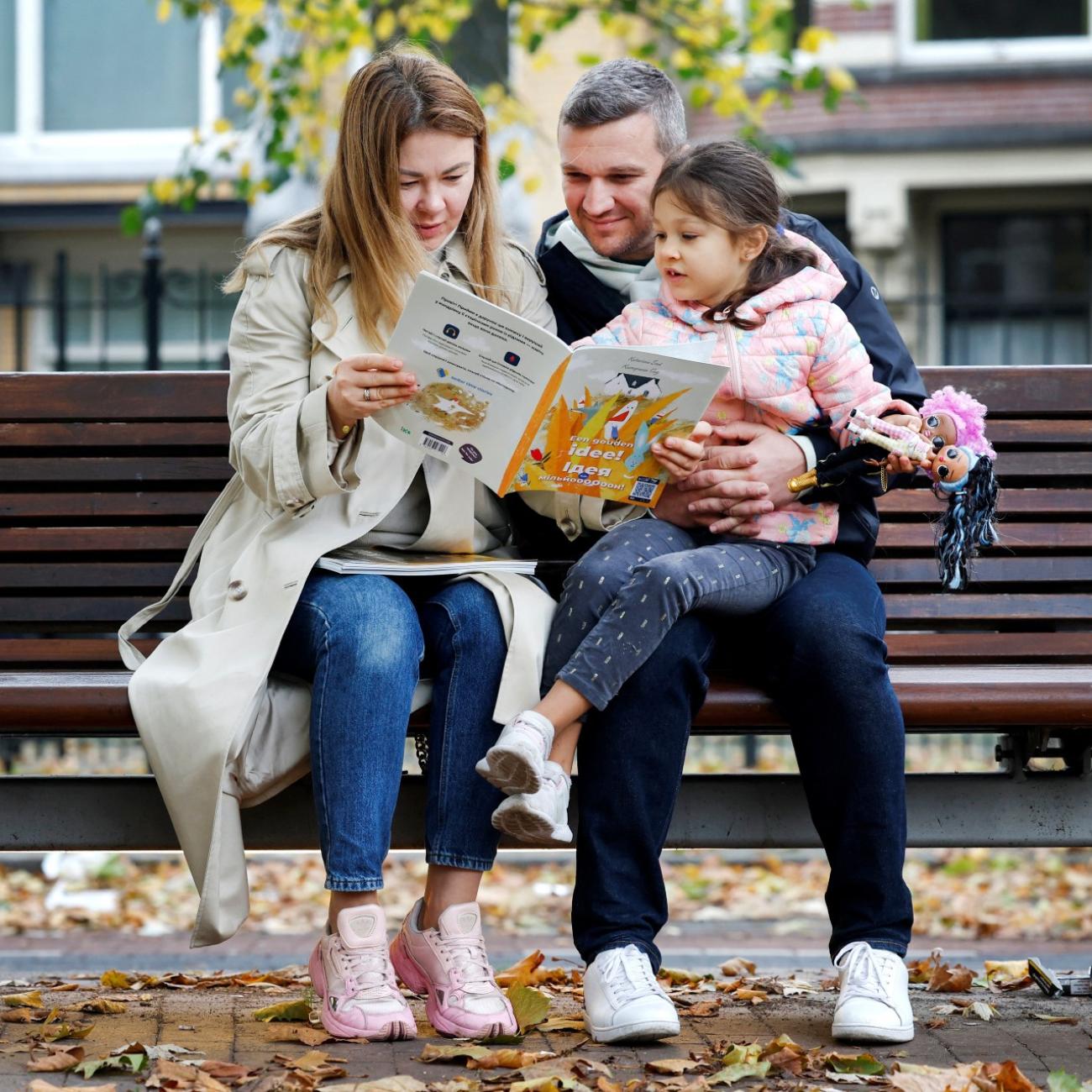 Ukrainian family Mykhalchenko read and listen to Better Time Stories, a project introduced for Ukrainian children who are seperated from their families in Rotterdam, Netherlands October 25, 2022. 