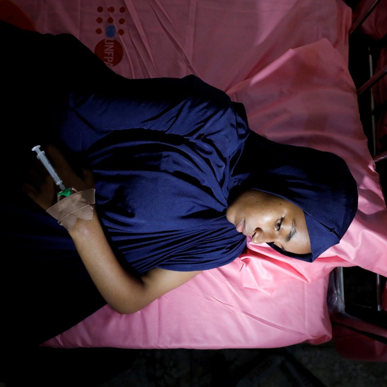 Ruqqayah Abubakar lies on a bed after being treated at an obstetric fistula repair centre in Maiduguri, Nigeria August 1, 2018.