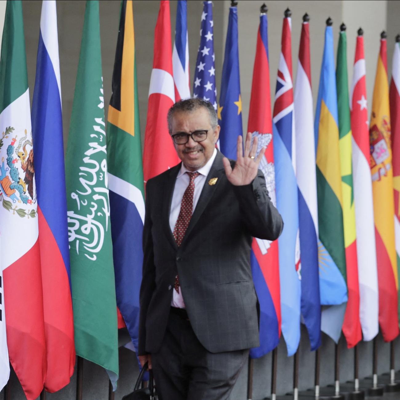 WHO Director-general Tedros waves