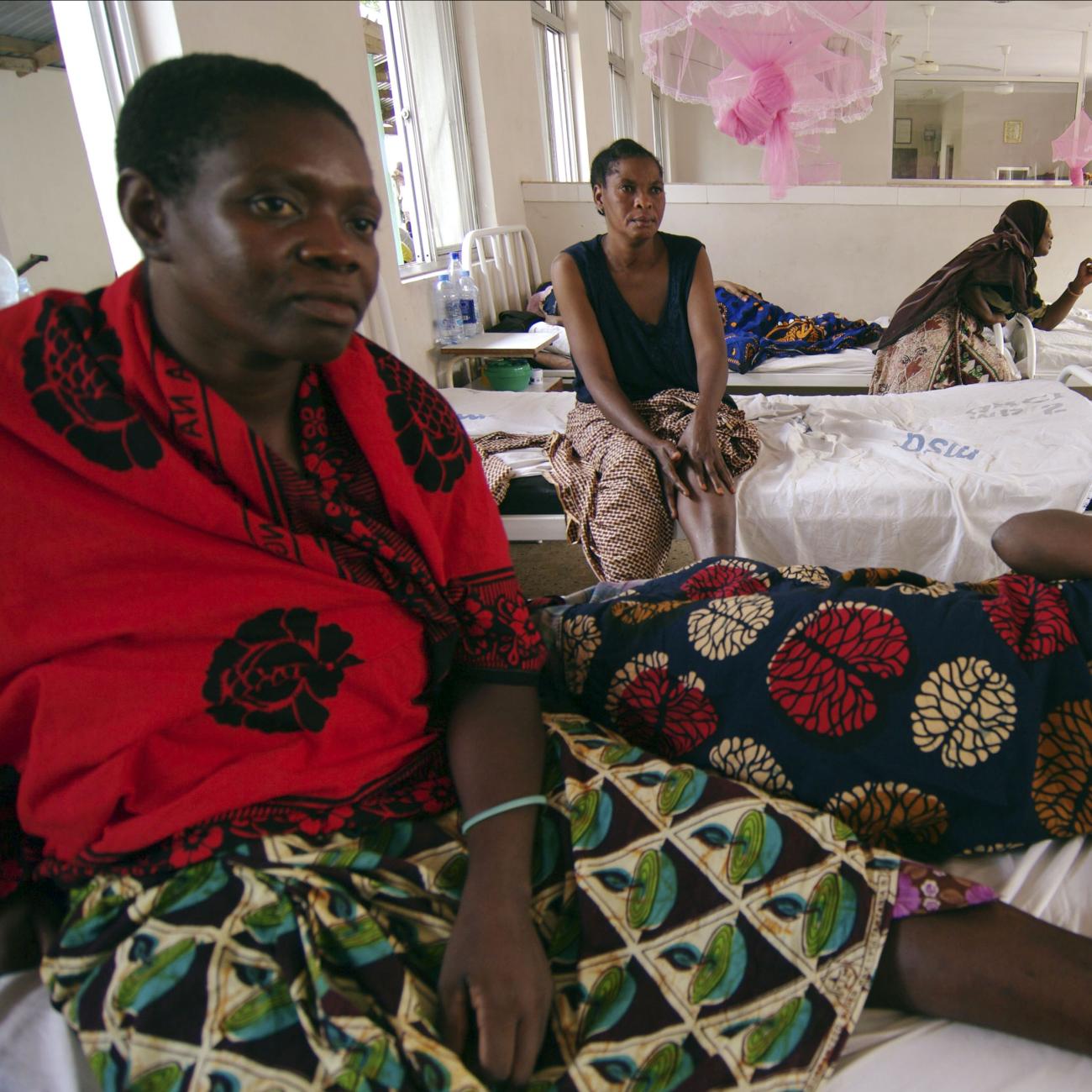 Rukia Kondogoza, a cervical cancer patient, shares a bed in a female ward of a cancer institute in the capital Dar es Salaam, Tanzania, on November 11, 2009. 