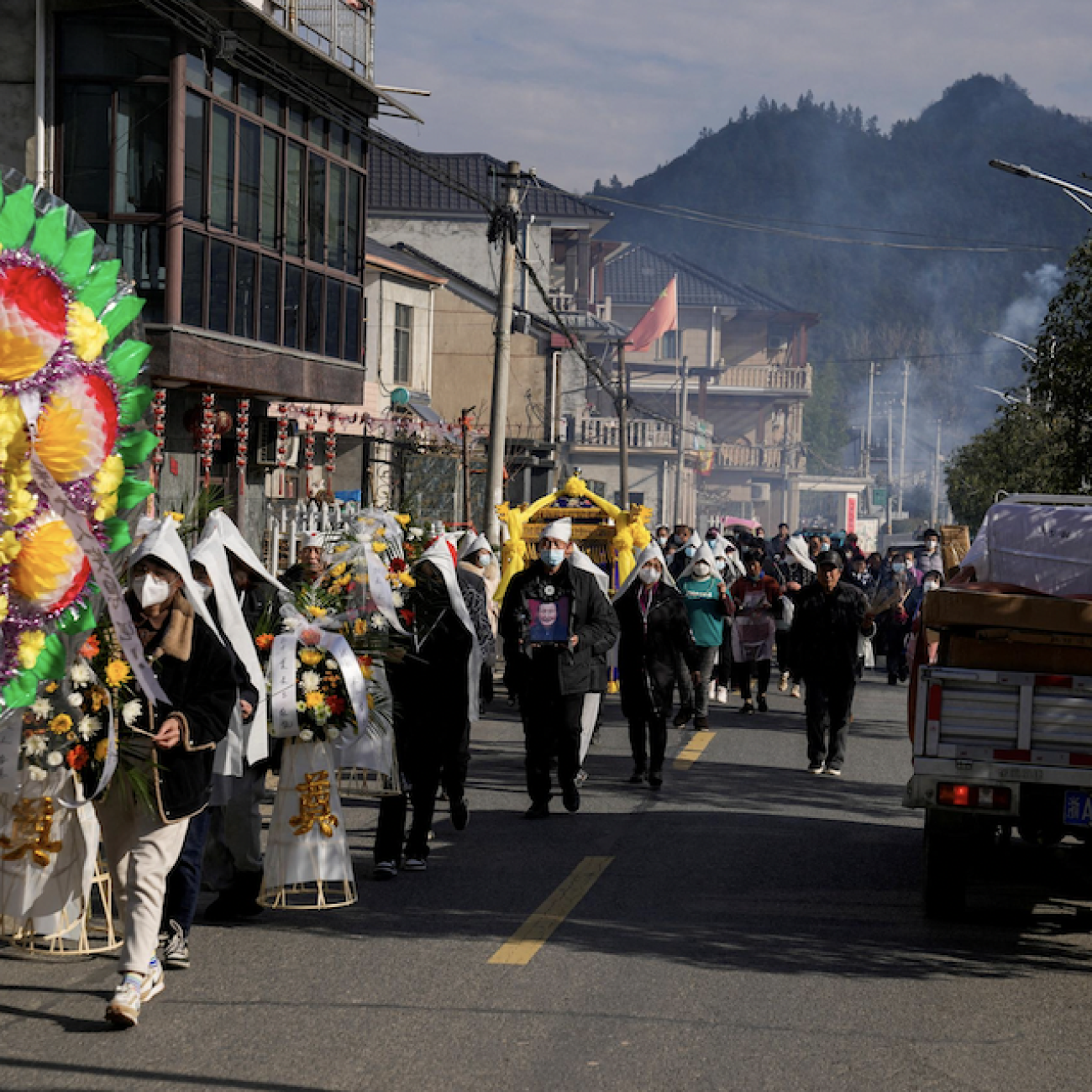 Relatives and neighbors attend the funeral of a woman surnamed Liu, as coronavirus disease (COVID-19) outbreak continues, at a village in Tonglu county, Zhejiang province, China, January 9, 2023. REUTERS/Aly Song