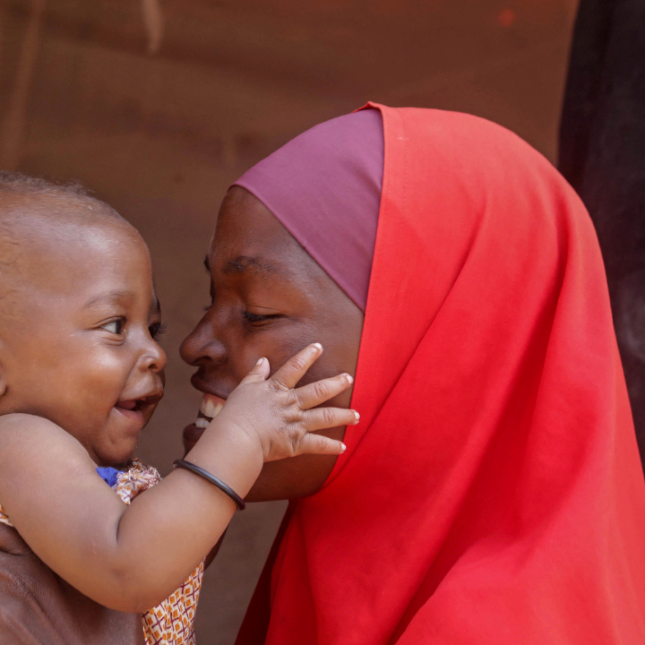 Nadifa Abdi Isak plays with her son Farhan, who recently received an emergency transfusion to treat malnutrition-induced anaemia in Mogadishu, Somalia, on December 1, 2022.