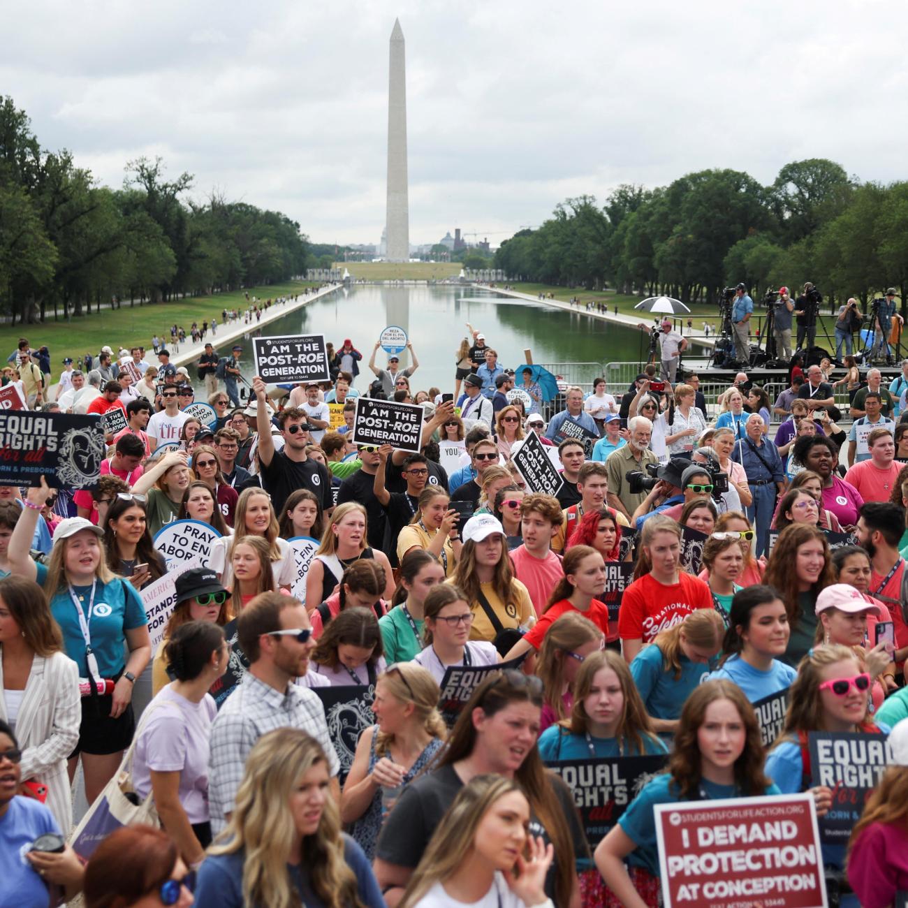 A crowd of anti-abortion demonstrators listen as former U.S. Vice President Mike Pence (not pictured) speaks at the "National Celebrate Life Day Rally" in Washington, DC.