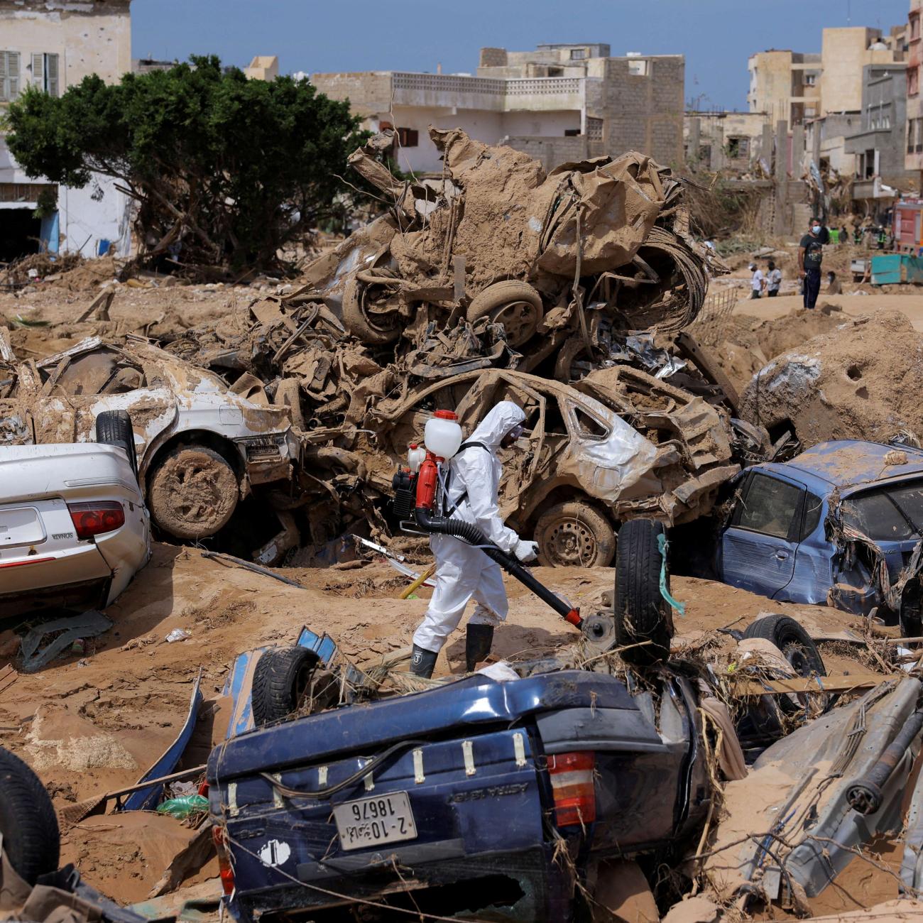 A sanitation worker disinfects rubble, amid rising concerns of spread of infectious diseases following fatal floods in Derna, Libya, September 17, 2023. 